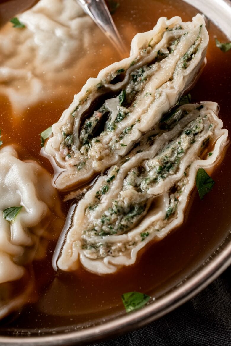 cross section of rolled maultaschen filled with spinach and meat