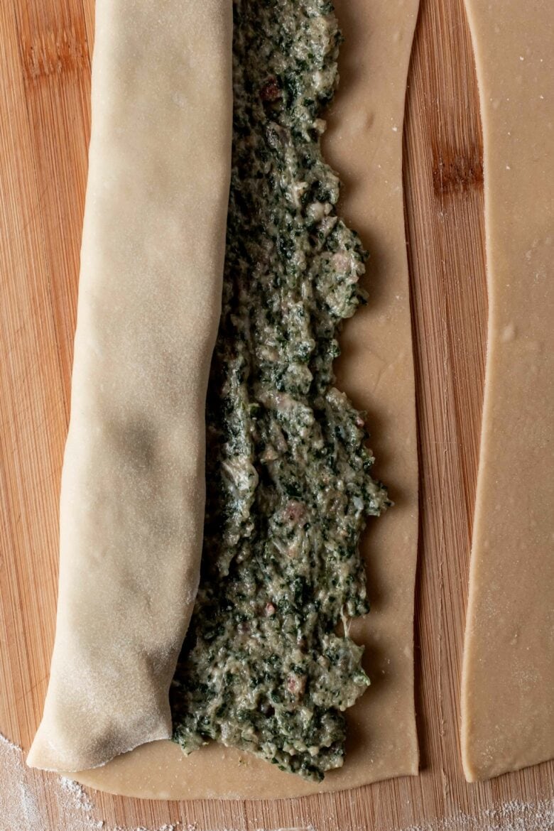 rolling up dough around filling