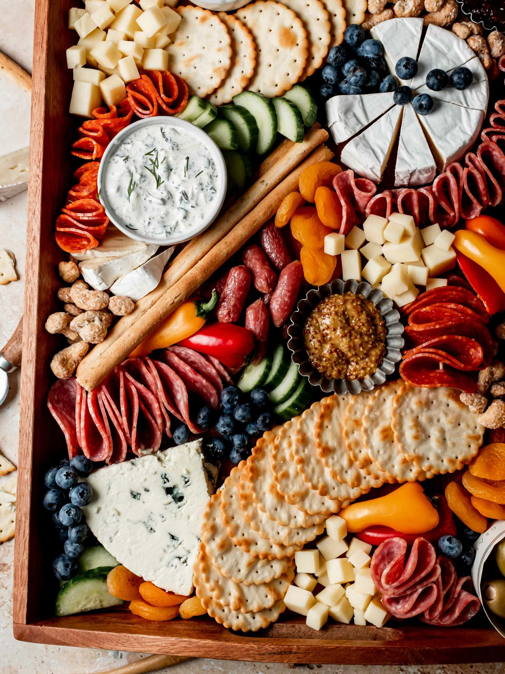 A beautifully arranged assortment of cured meats, cheeses, and accompaniments.