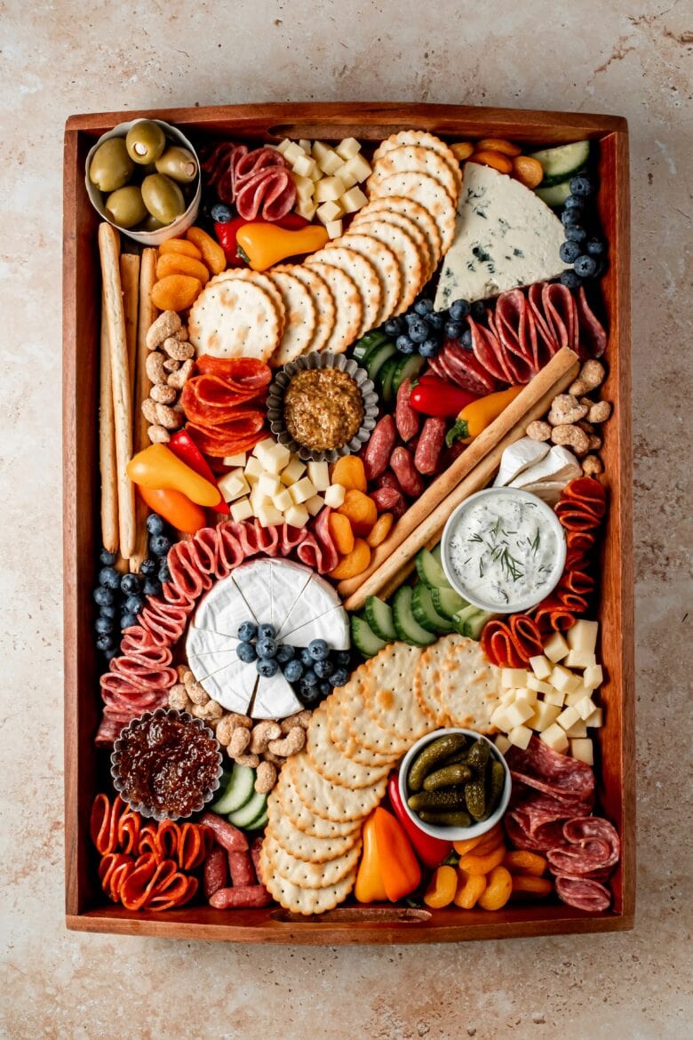 Finished charcuterie board with accents.