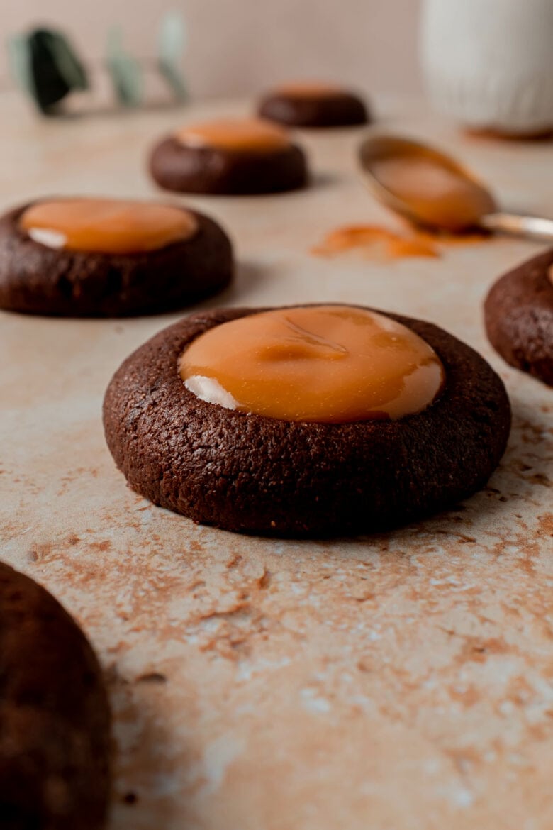 Chocolate thumbprint cookie filled with homemade dulce de leche.