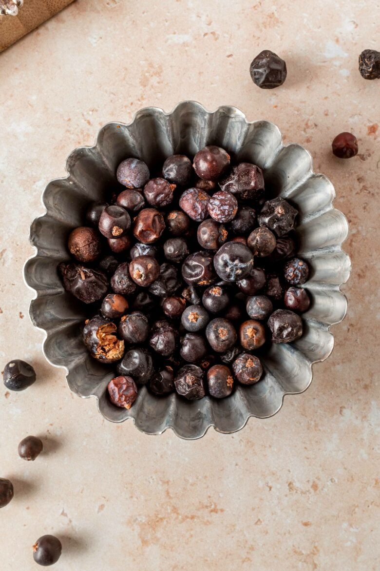 Juniper berries for cooking in small tin.