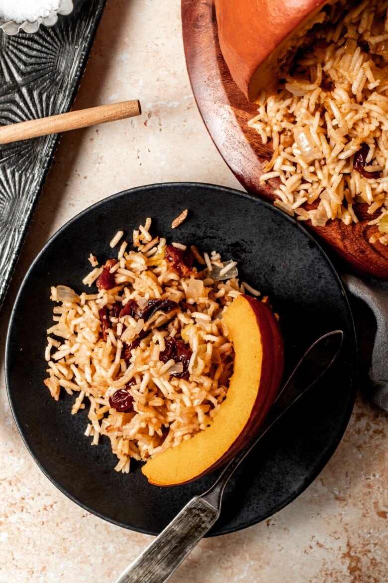 Slice of pumpkin topped with rice stuffing.