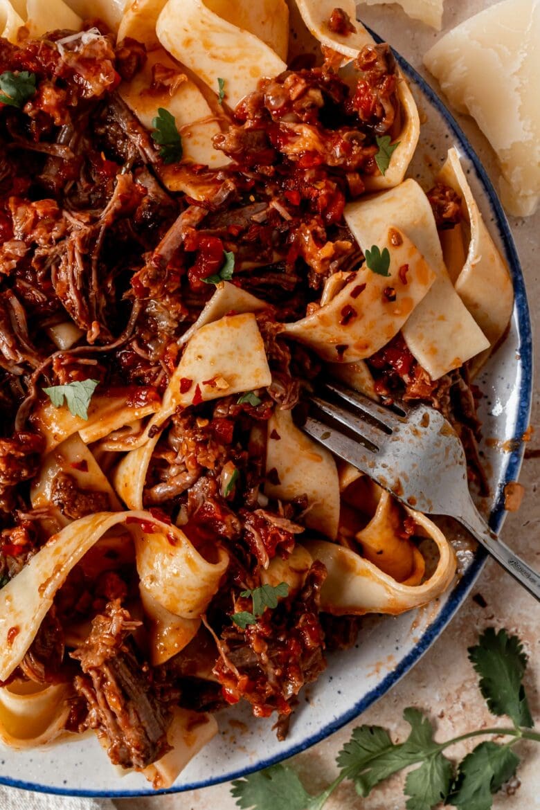Ragu mixed with pappardelle noodles.