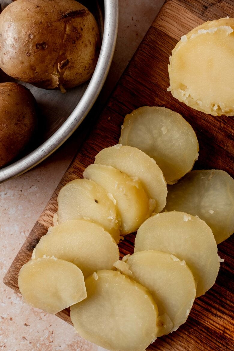 Peeled and sliced boiled potatoes.