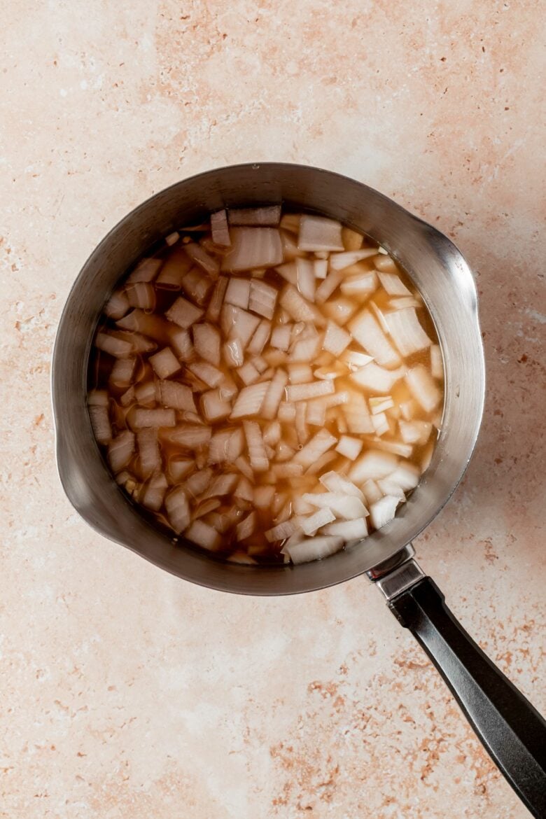 Vinegar, broth, chopped onions and dijon mustard in small saucepan.