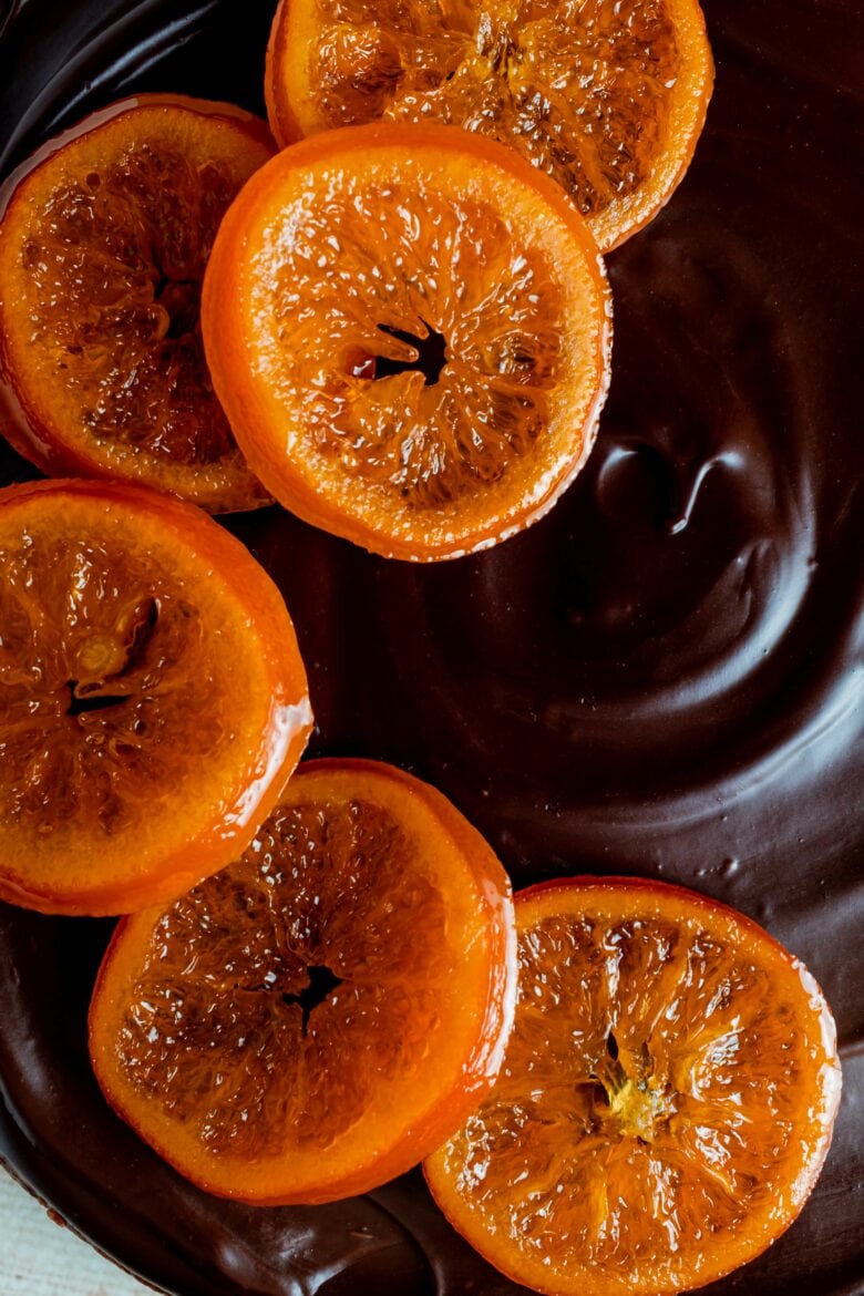 Chocolate ganache topping with candied orange slices.