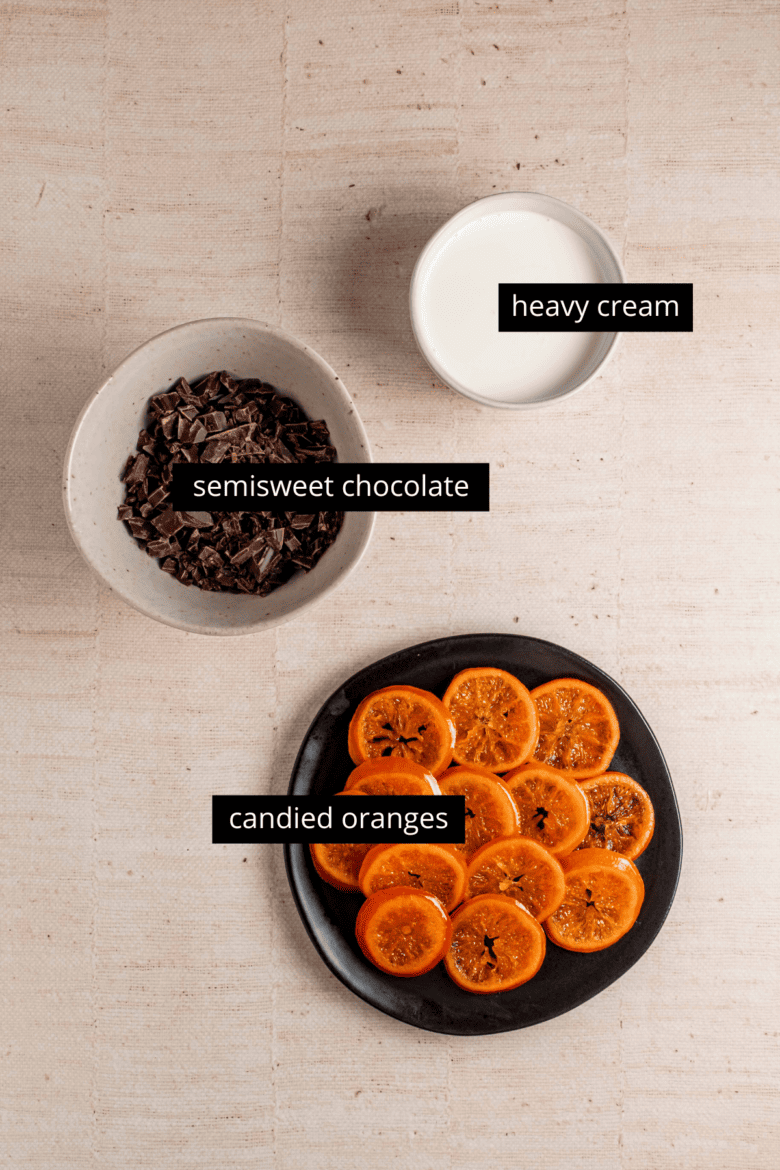Candied orange slices and ingredients to make chocolate ganache.