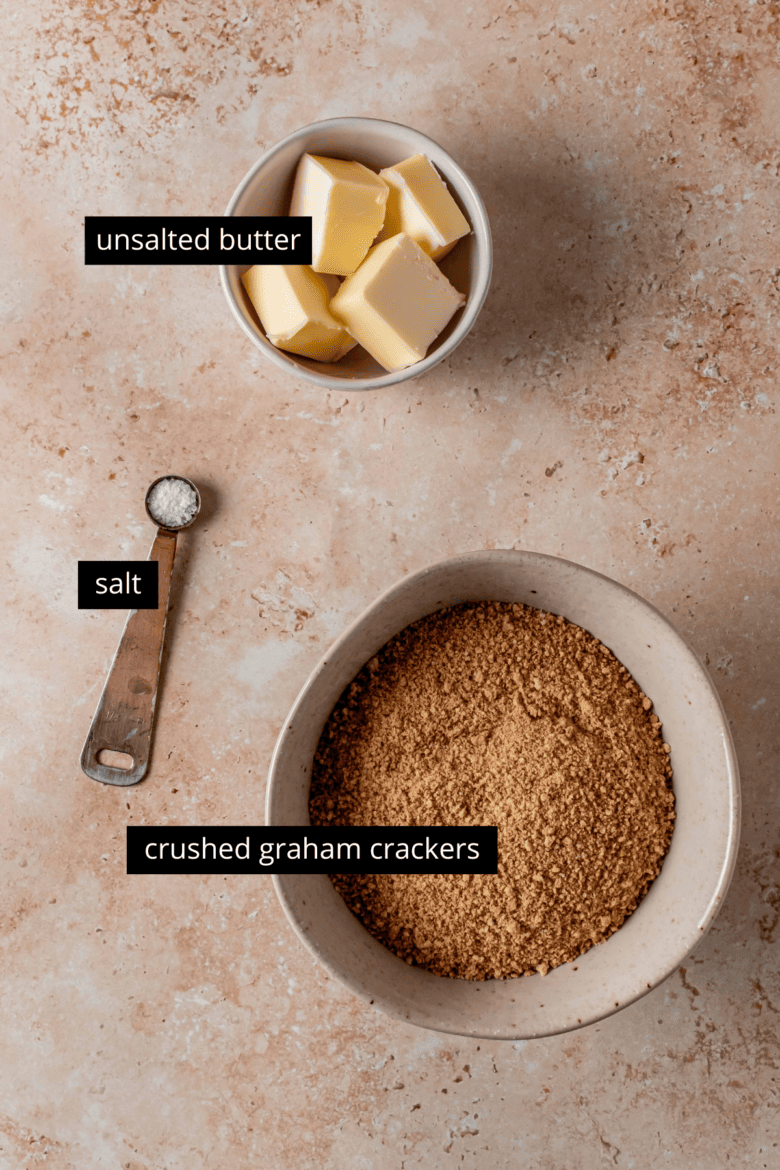 Measured ingredients ready to make graham cracker crust.