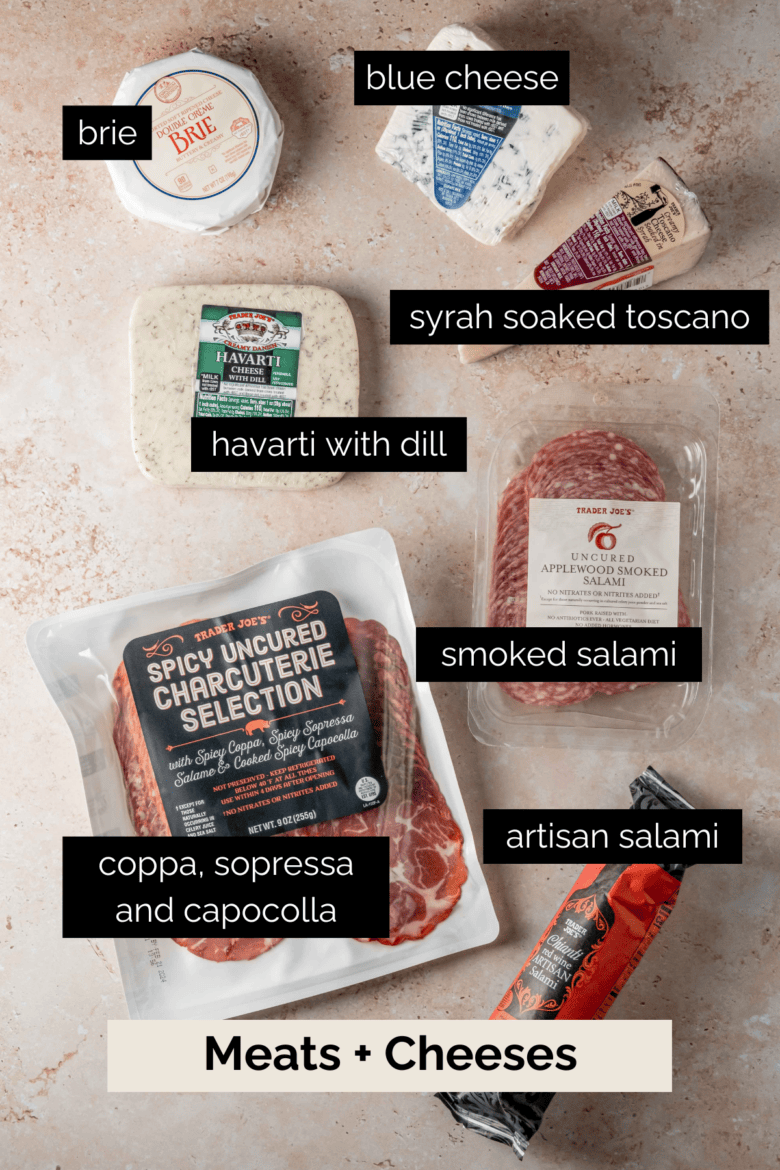 A variety of cheeses and meats in their packaging.