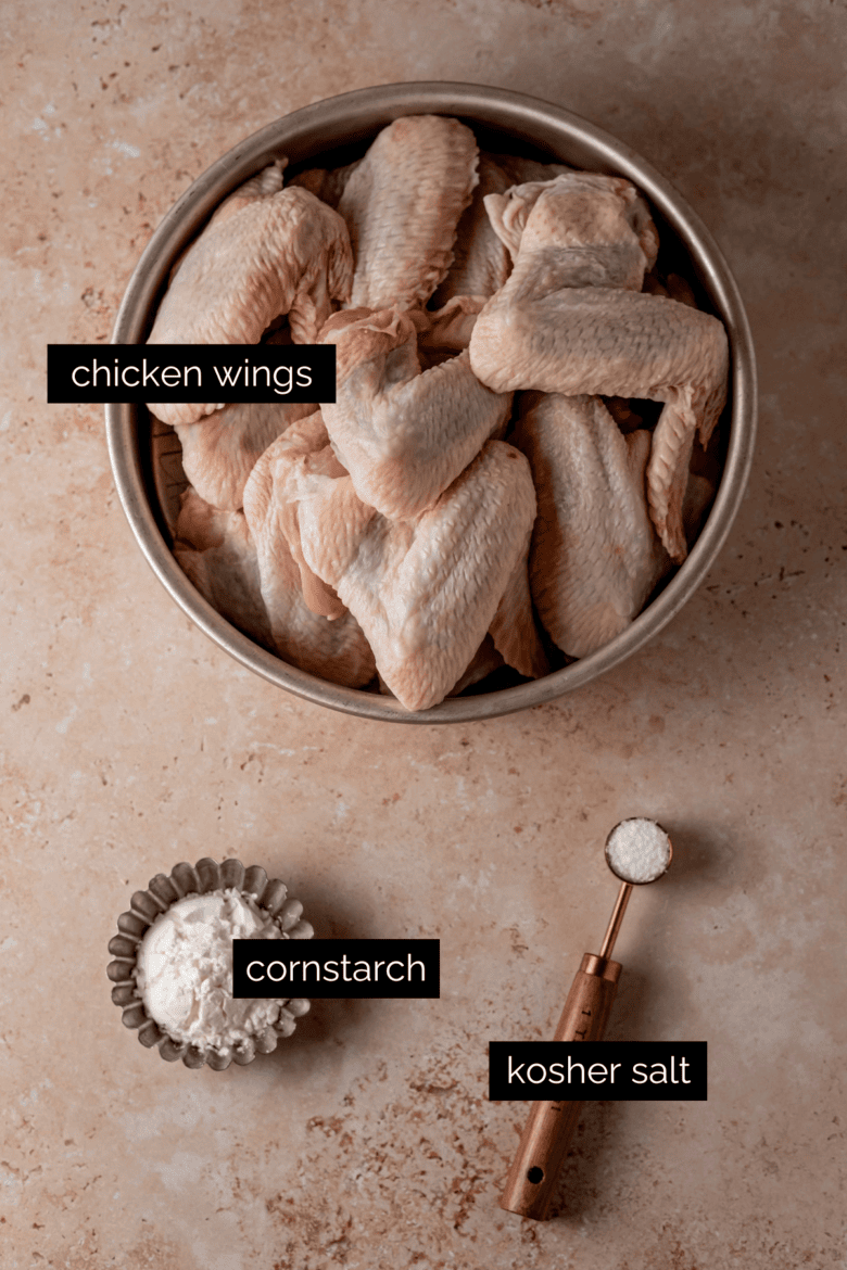 Chicken wings, cornstarch and kosher salt measured and ready to make crispy wings.