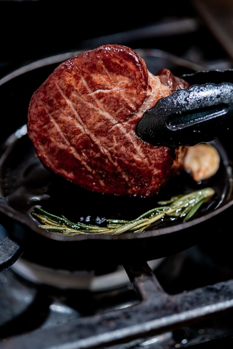 Searing the sides of the steak.