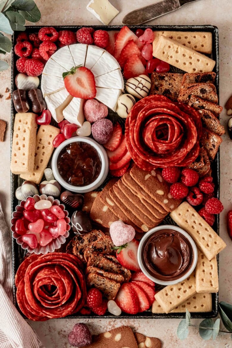 Valentine's snack platter featuring sweet and savory treats.