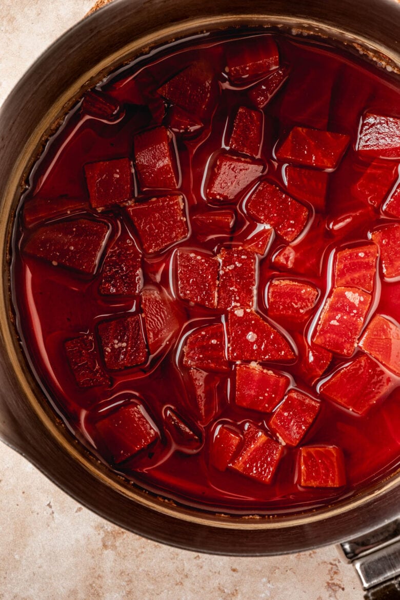 Cubed beets simmering in water.