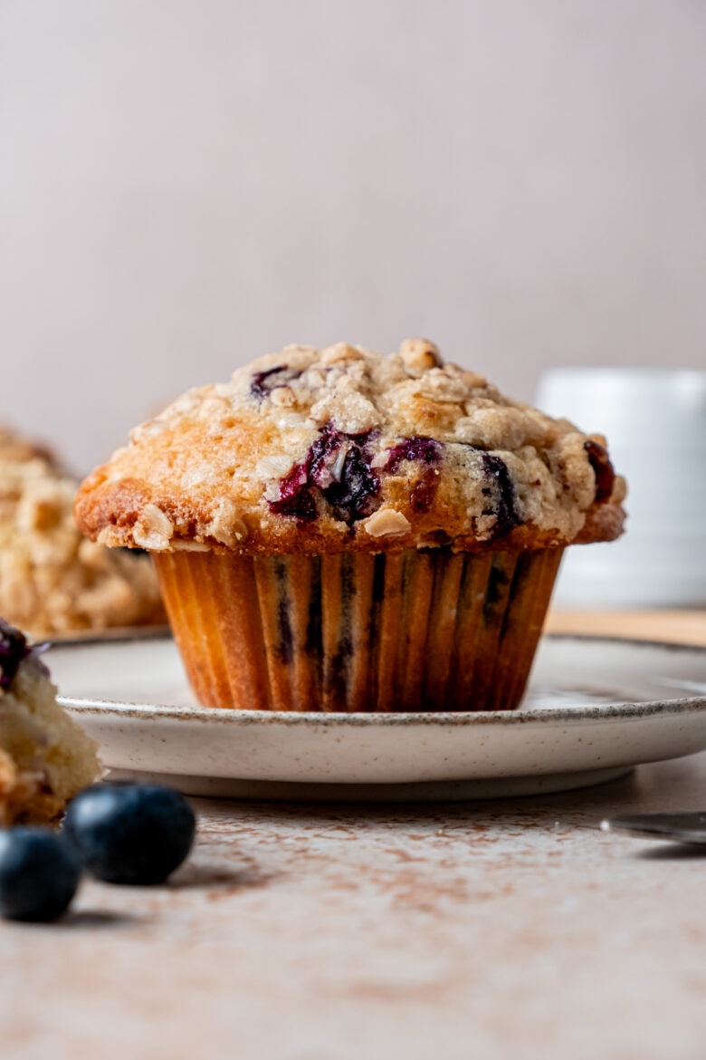 Close up of blueberry muffin with streusel topping.
