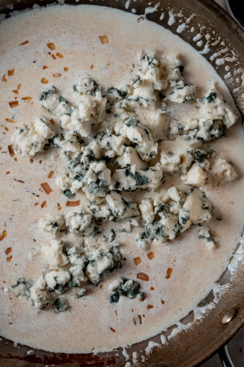Crumbled blue cheese added to the creamy sauce.