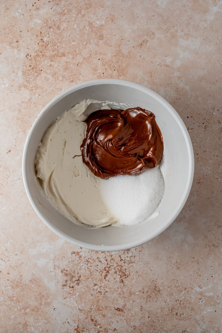 Cream cheese, Nutella and sugar in mixing bowl.