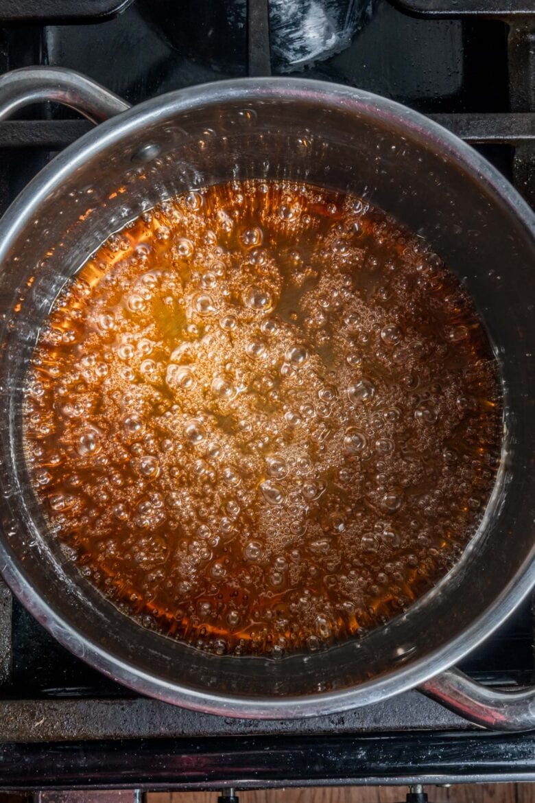 Showing deep amber color of caramel in pot.