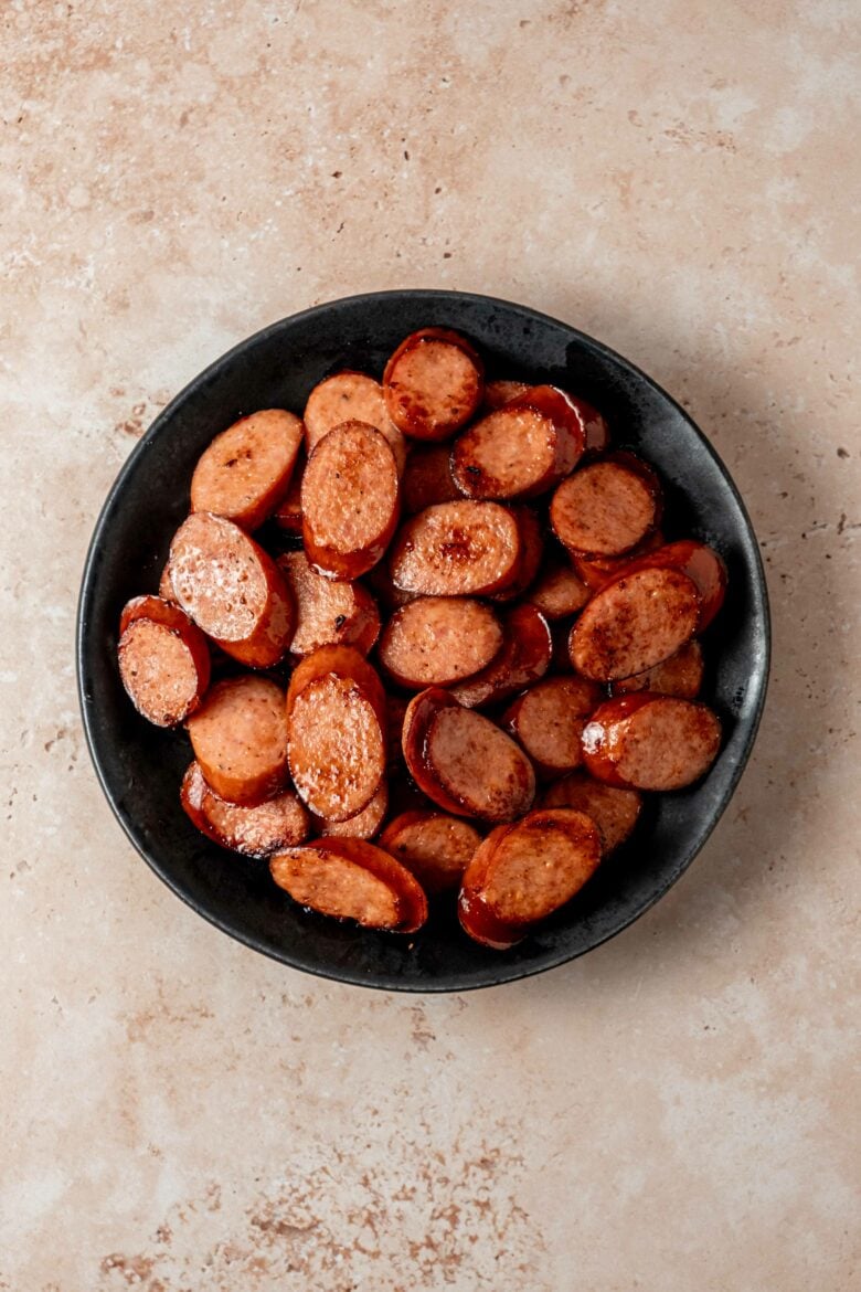 Sauteed sausage slices on a plate.