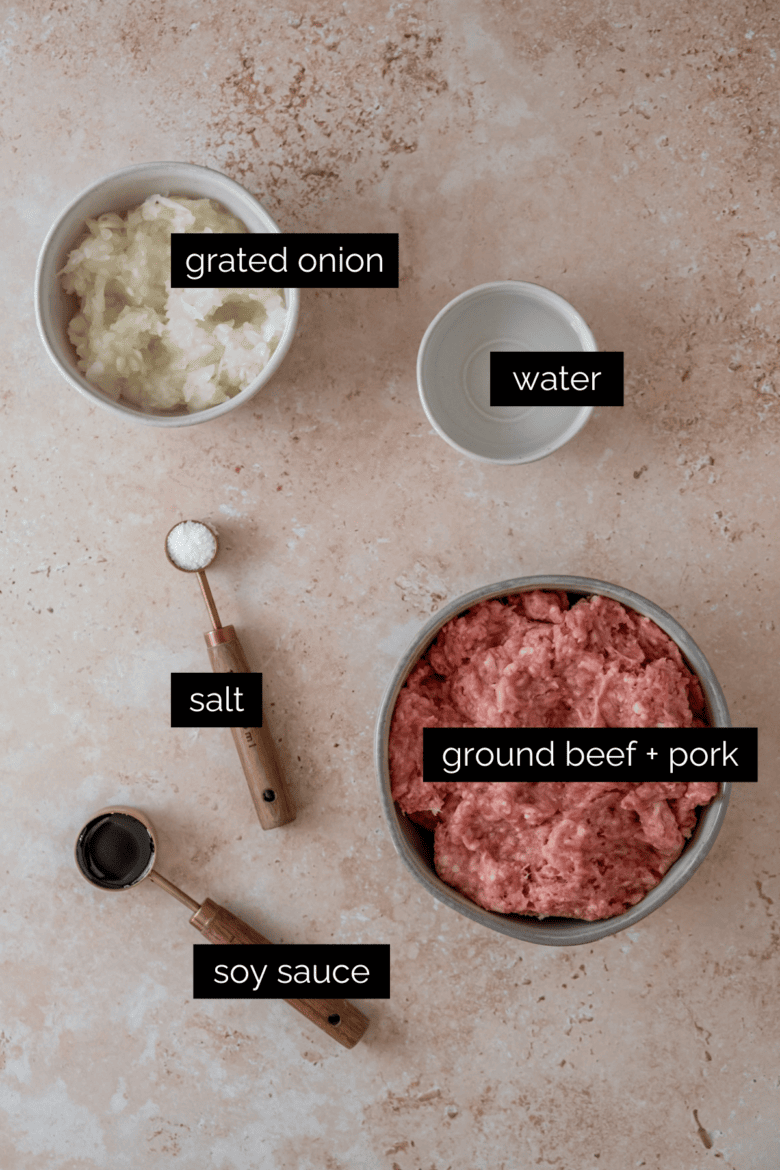 Measured ingredients to make meat filling for pelmeni.