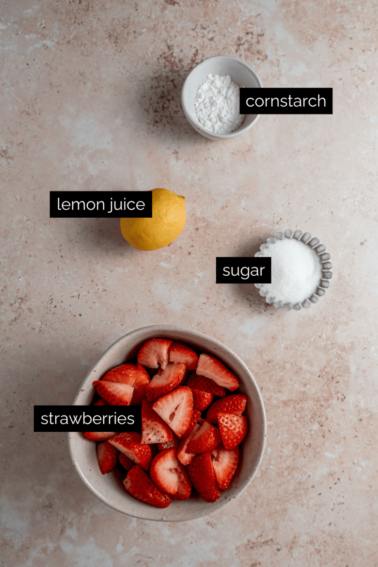 Measured ingredients to make strawberry topping.