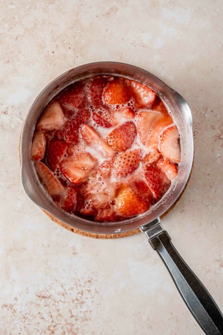 Strawberries cooking in saucepan.