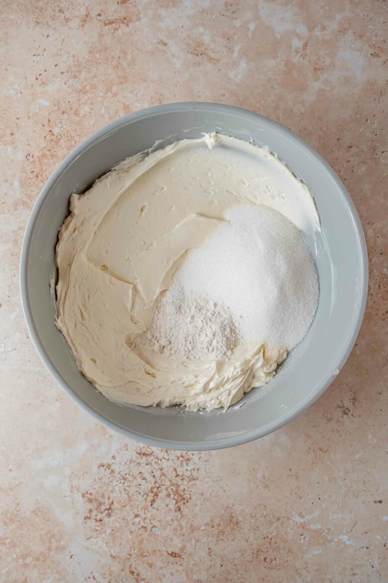 Mixing the softened cream cheese with sugar, flour and salt.