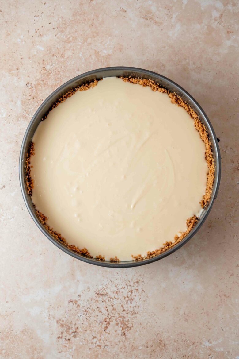 Unbaked cheesecake in springform pan.