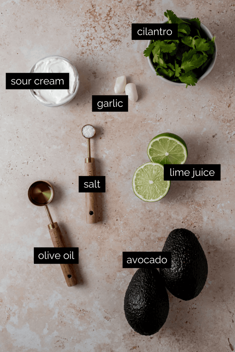 Measured ingredients to make avocado lime crema.