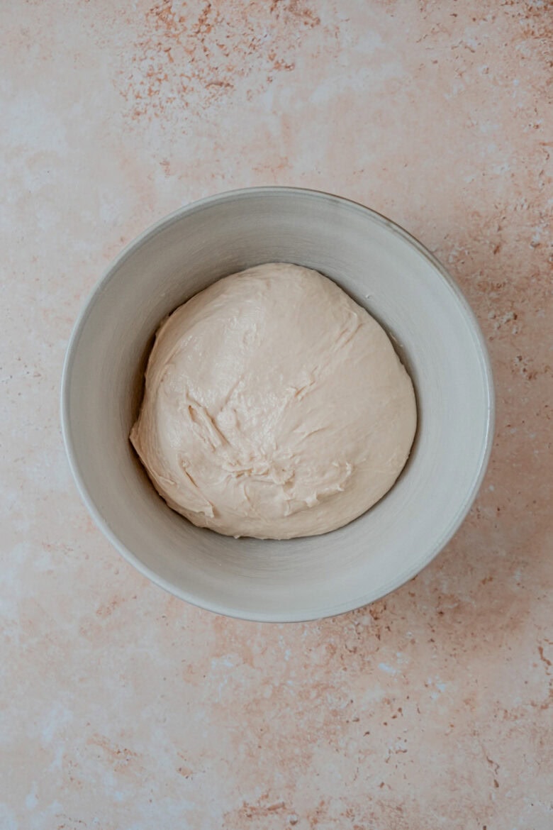 Dough in greased bowl before resting.