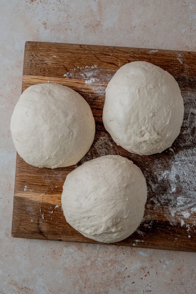 Separating dough into three portions.