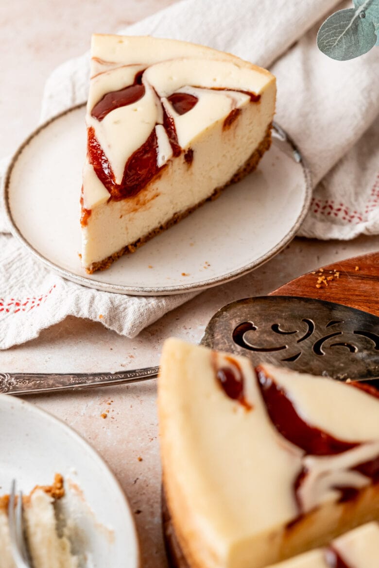 Overhead view of slice of cheesecake on a plate.