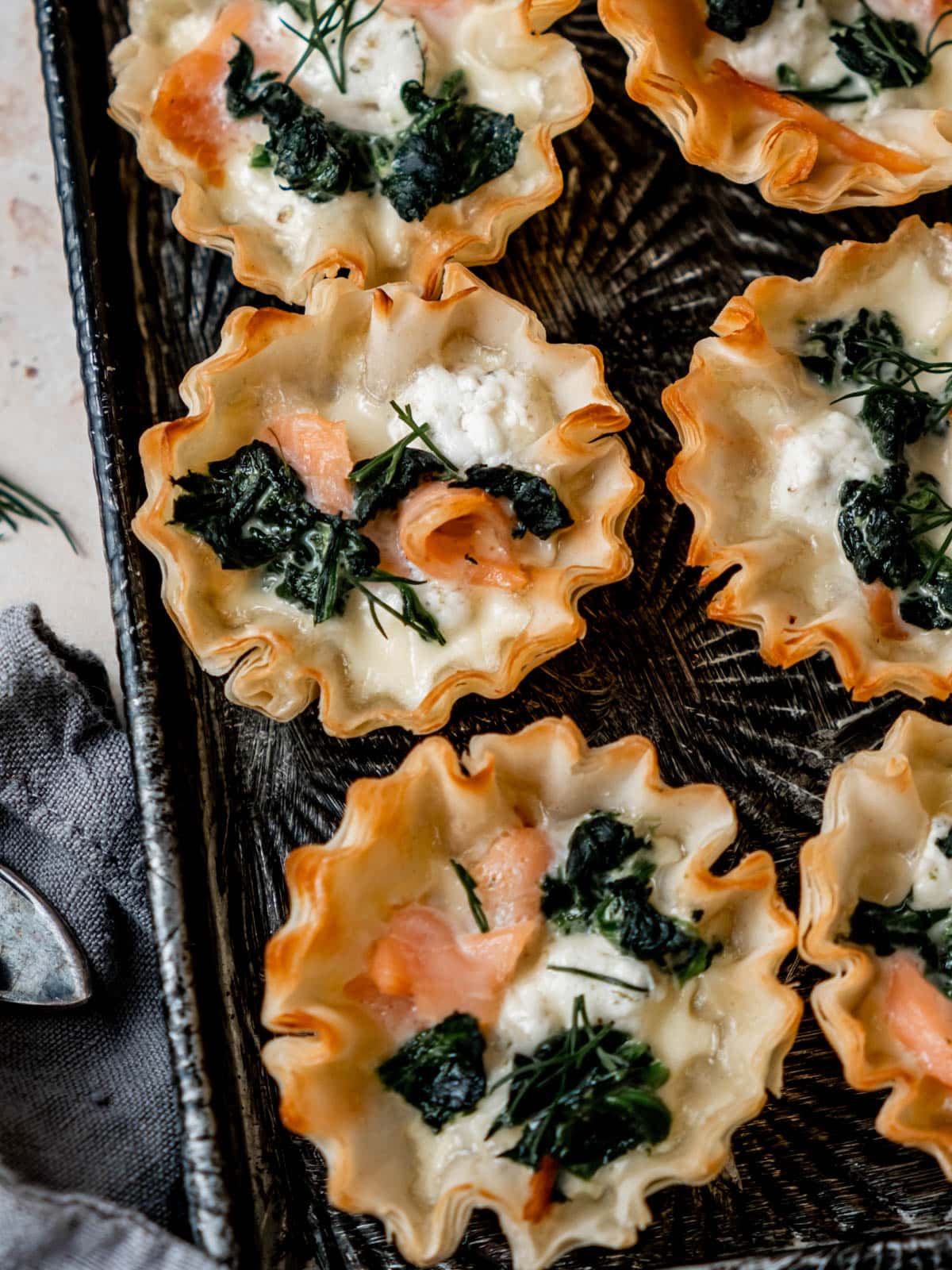 Smoked salmon, goat cheese and spinach baked in phyllo cup.