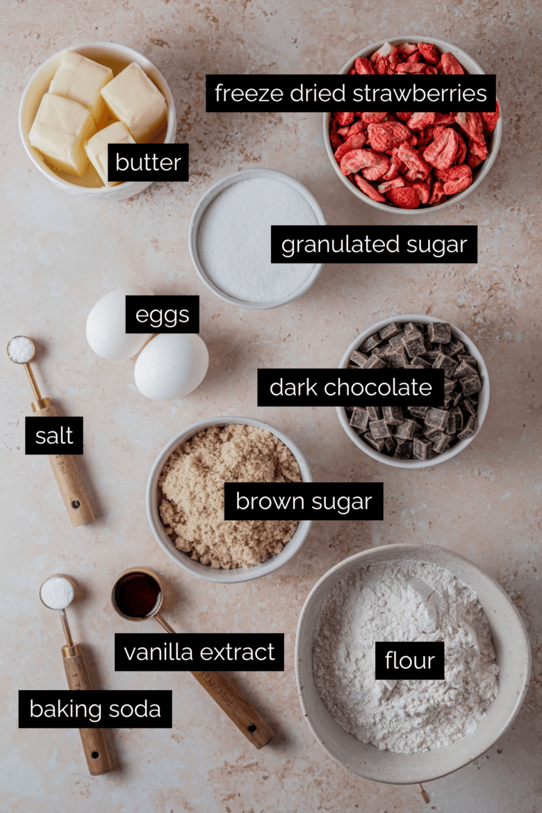 Measured ingredients to make chocolate chip cookies with freeze dried strawberries.