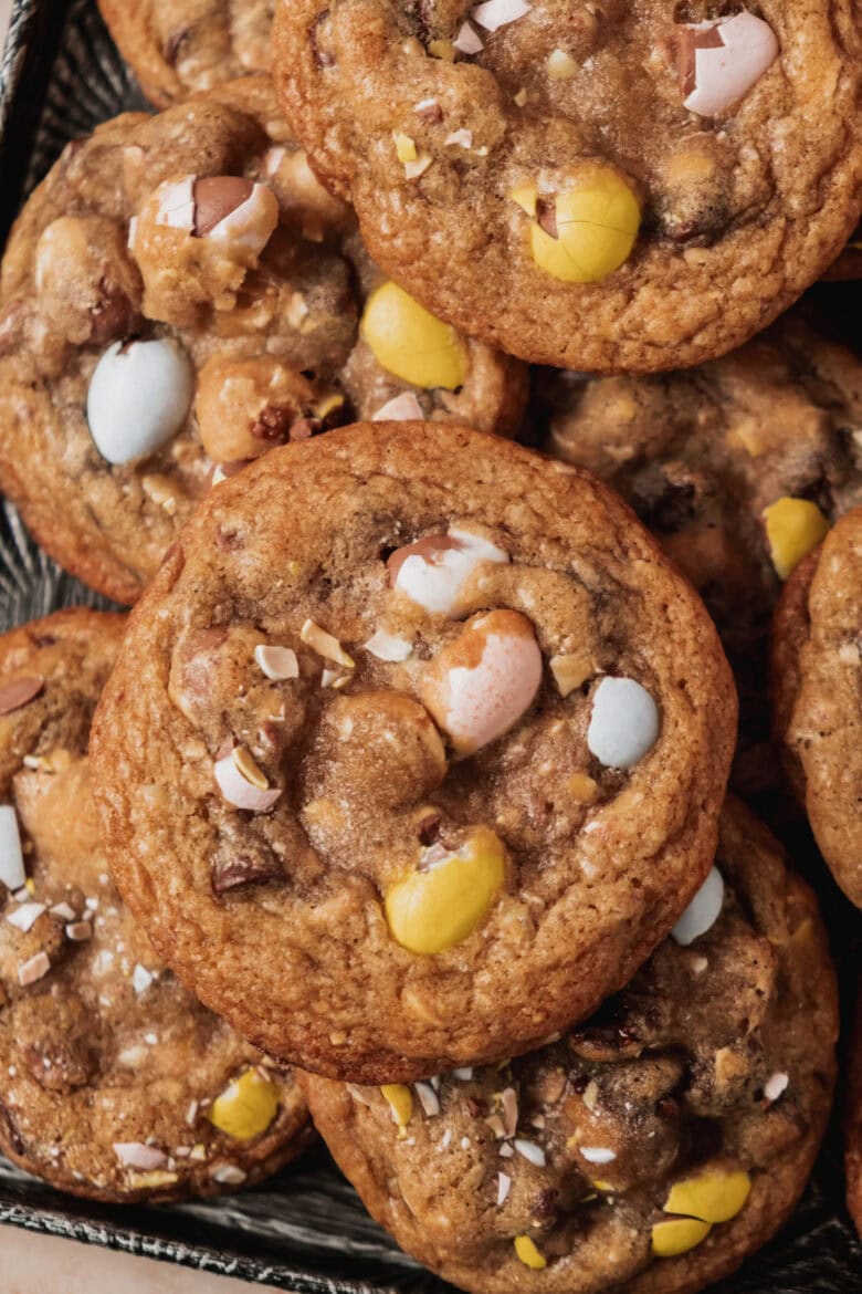 Close up of cookies with chocolate chips and crushed Cadbury mini eggs.