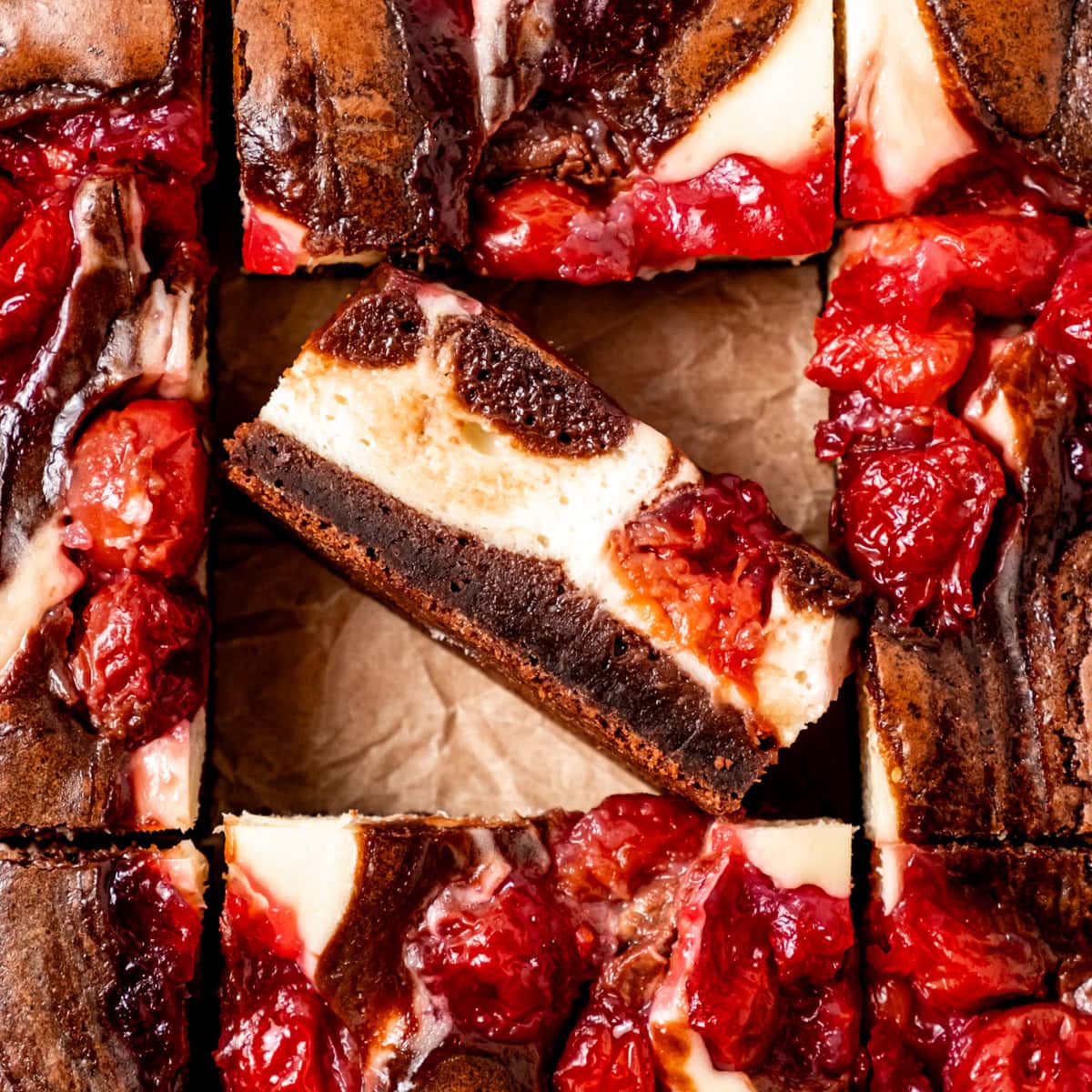 Brownies with cheesecake layer and cherry swirl.