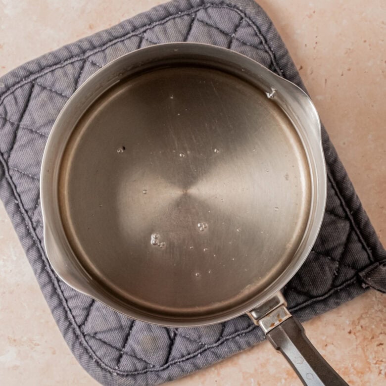 Simple syrup in small saucepan.